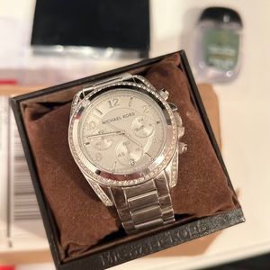 Michael Kors Silver Watch with sparkles around face and extra links-lightly warn